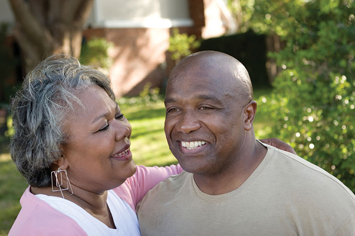 A mother looks fondly at her adult son. Links to Gifts That Pay You Income